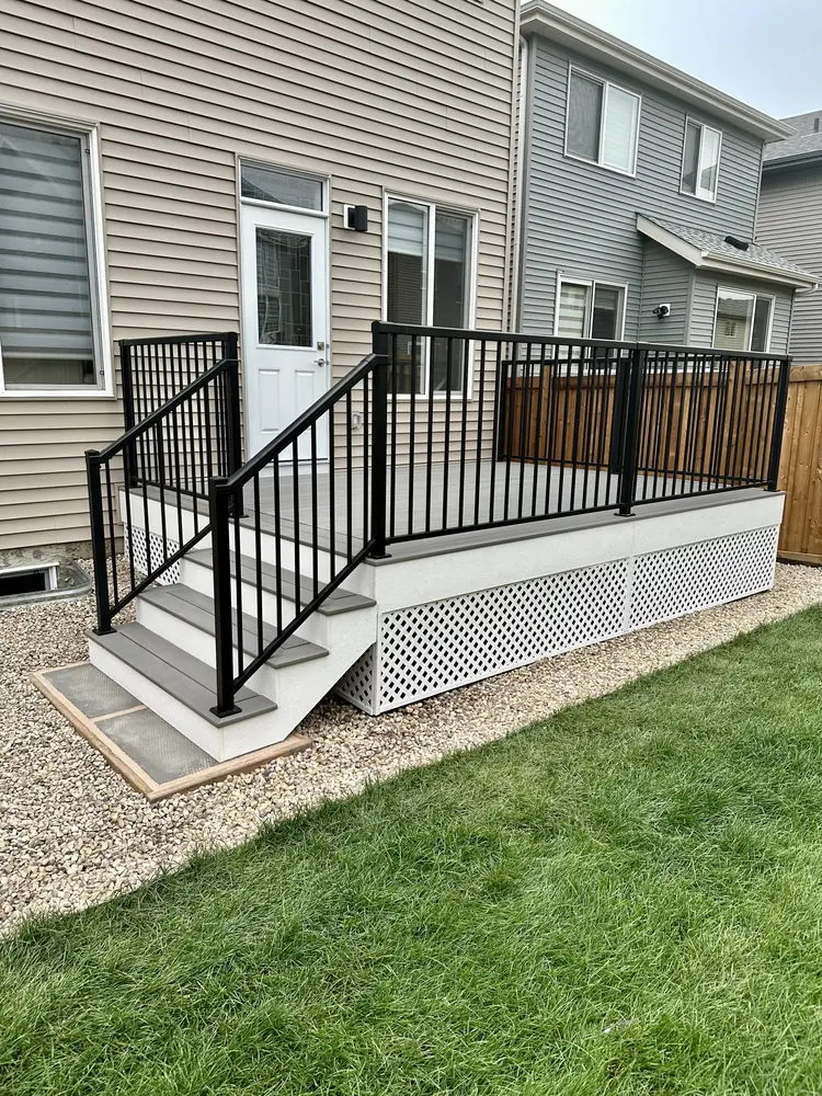 TimberTech composite deck with black aluminum railing in Keswick, southwest Edmonton — TrueBlue Builders